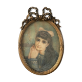 Portrait of a young girl in pastel and beautiful oval frame