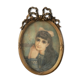Portrait of a young girl in pastel and beautiful oval frame