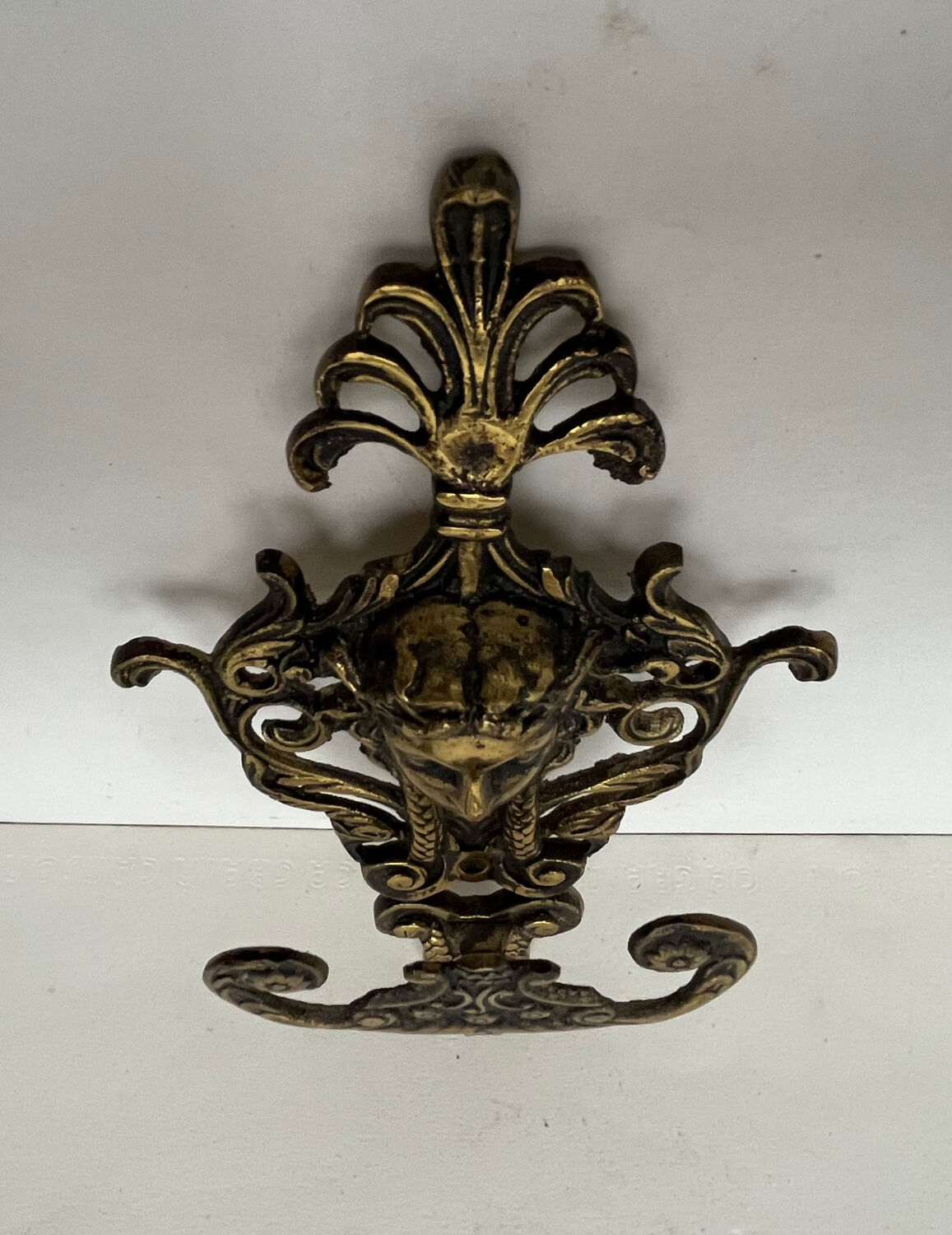 Antique hook in gilded bronze
