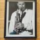 Framed and signed photo of saxophonist musician