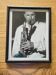 Framed and signed photo of saxophonist musician