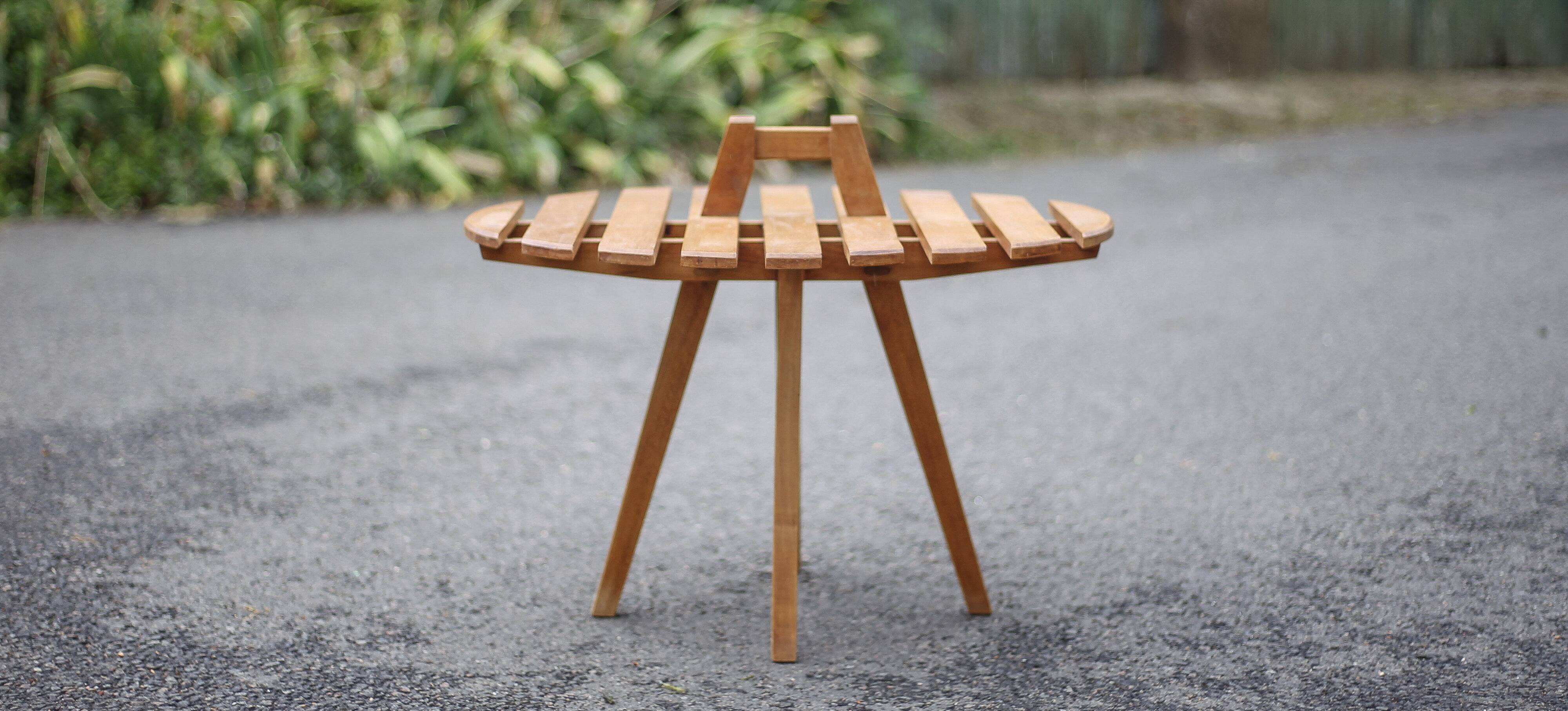 Vintage coffee table, wooden table with central handle, interior decoration, terrace, patio