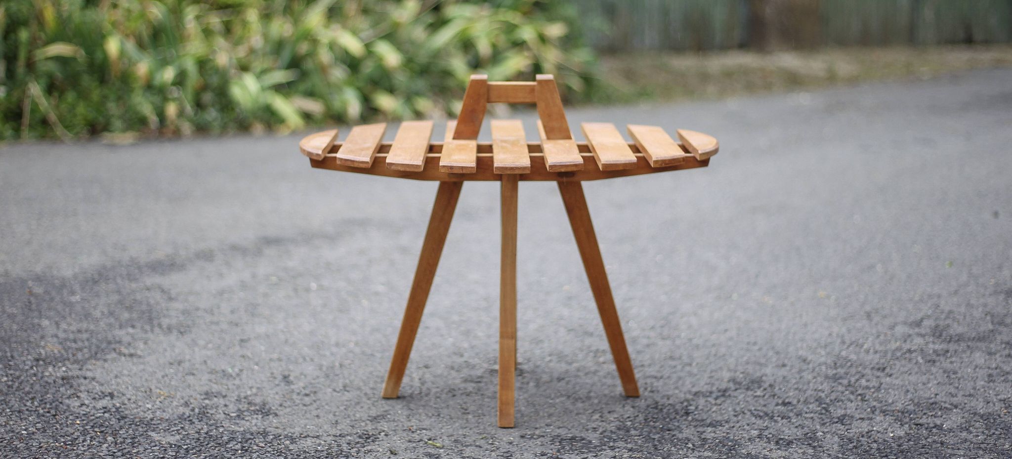 Vintage coffee table, wooden table with central handle, interior decoration, terrace, patio