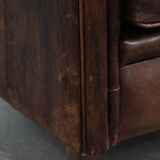 Vintage sheepskin armchair with warm colours and a characterful appearance