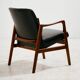 Teak armchair with leather upholstery
