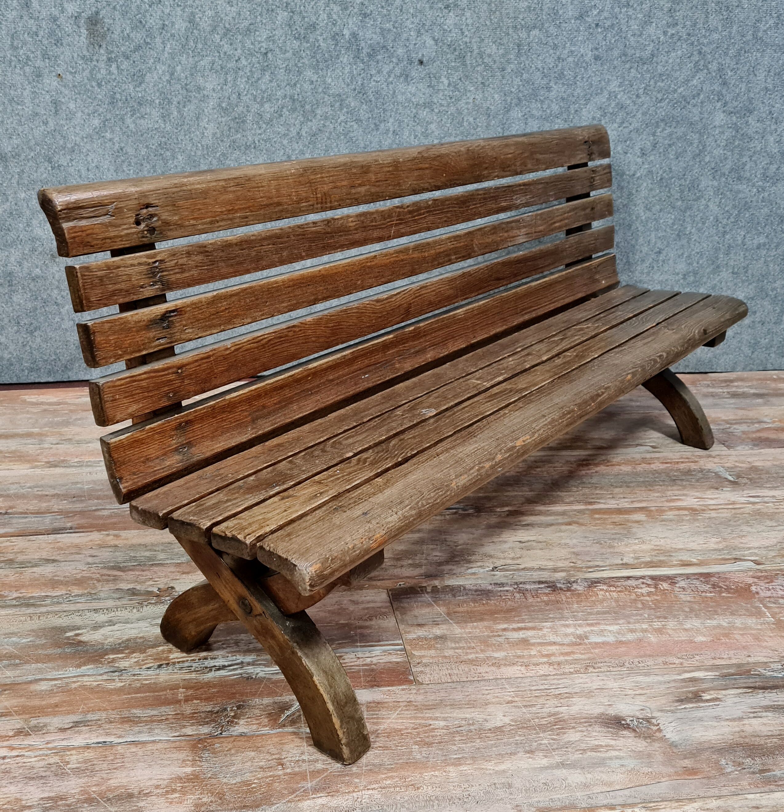 Park bench and garden with natural wood backrest xixth century