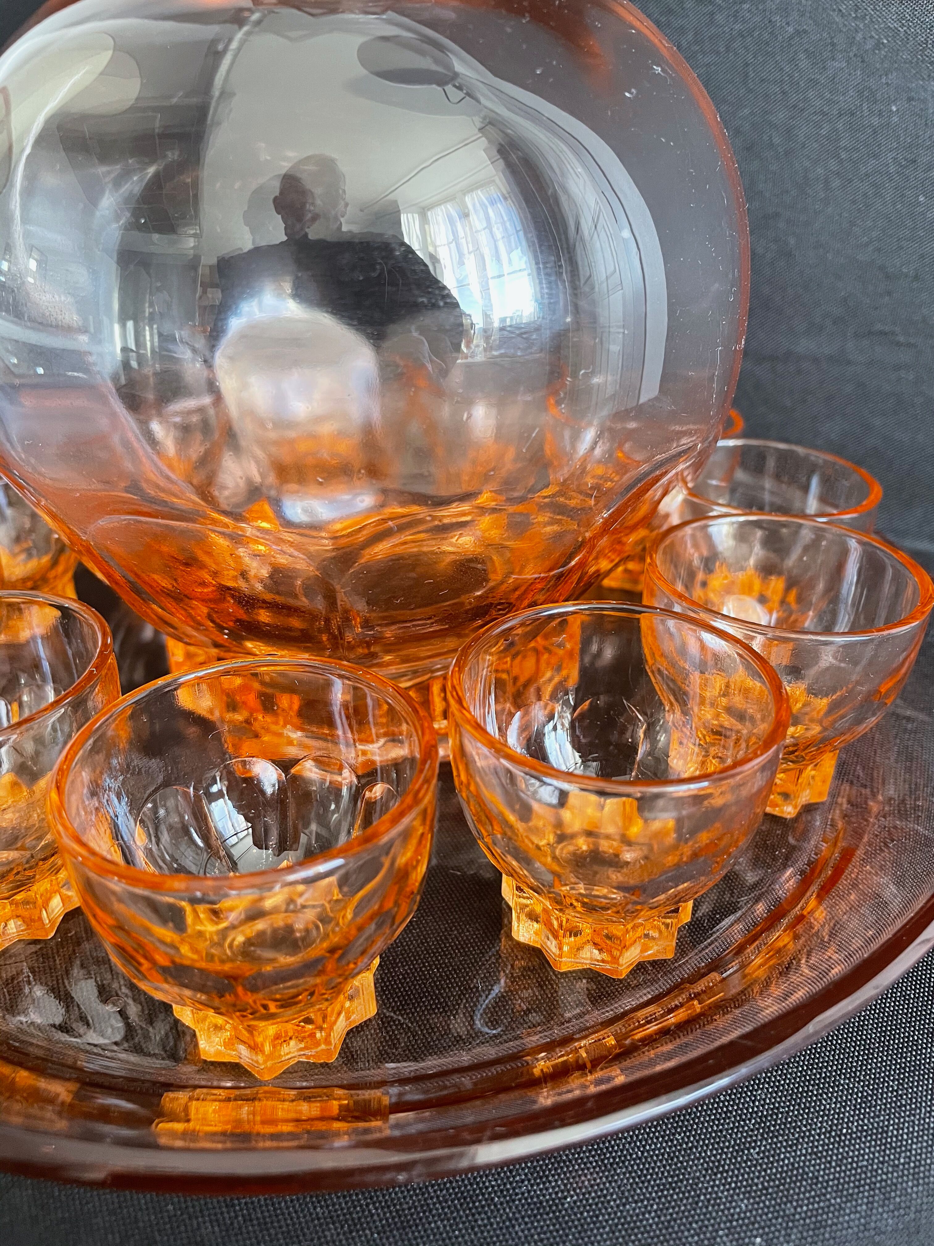 Liquor service in pink moulded glass