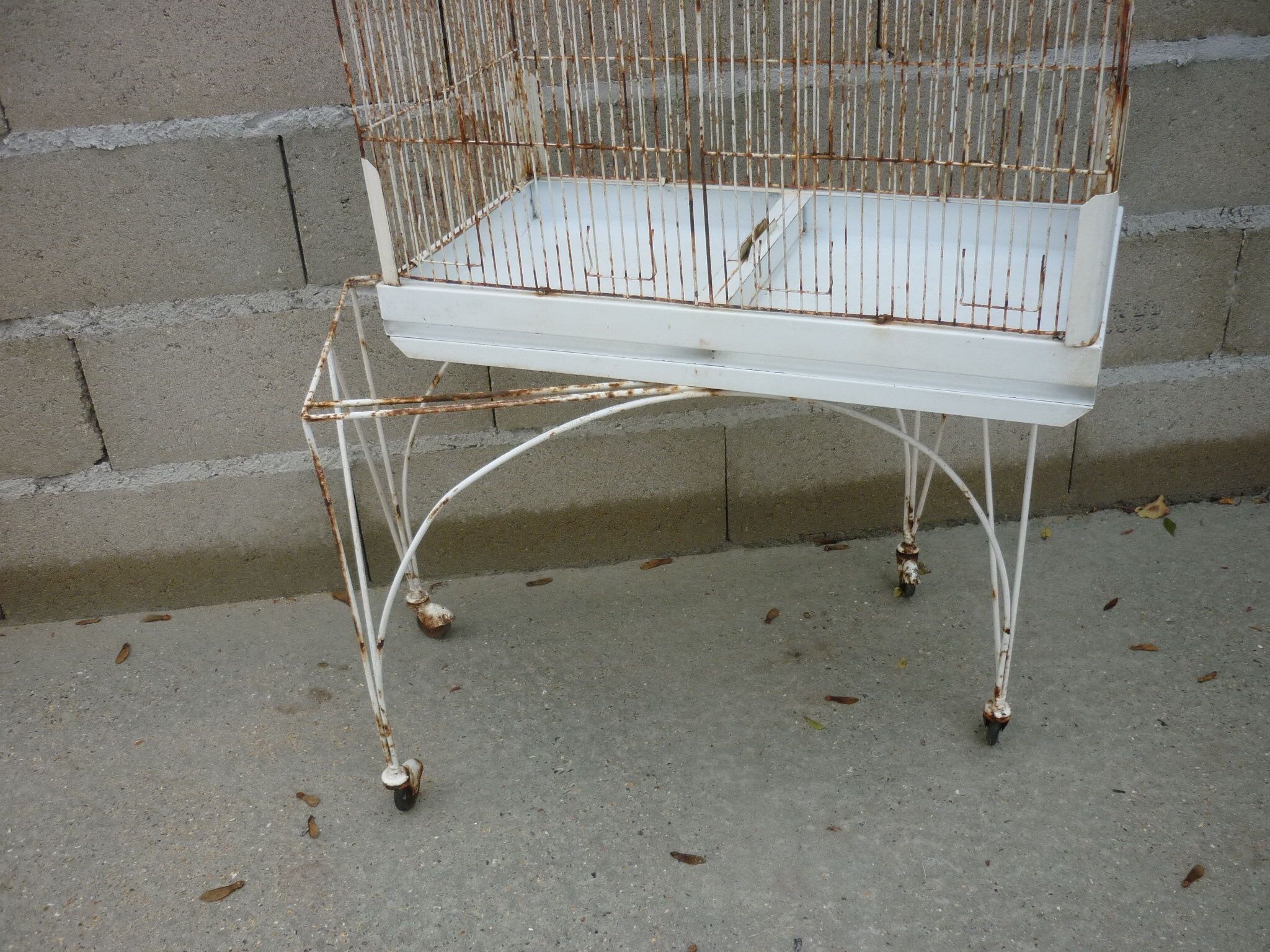 Bird cage with its wheeled holder