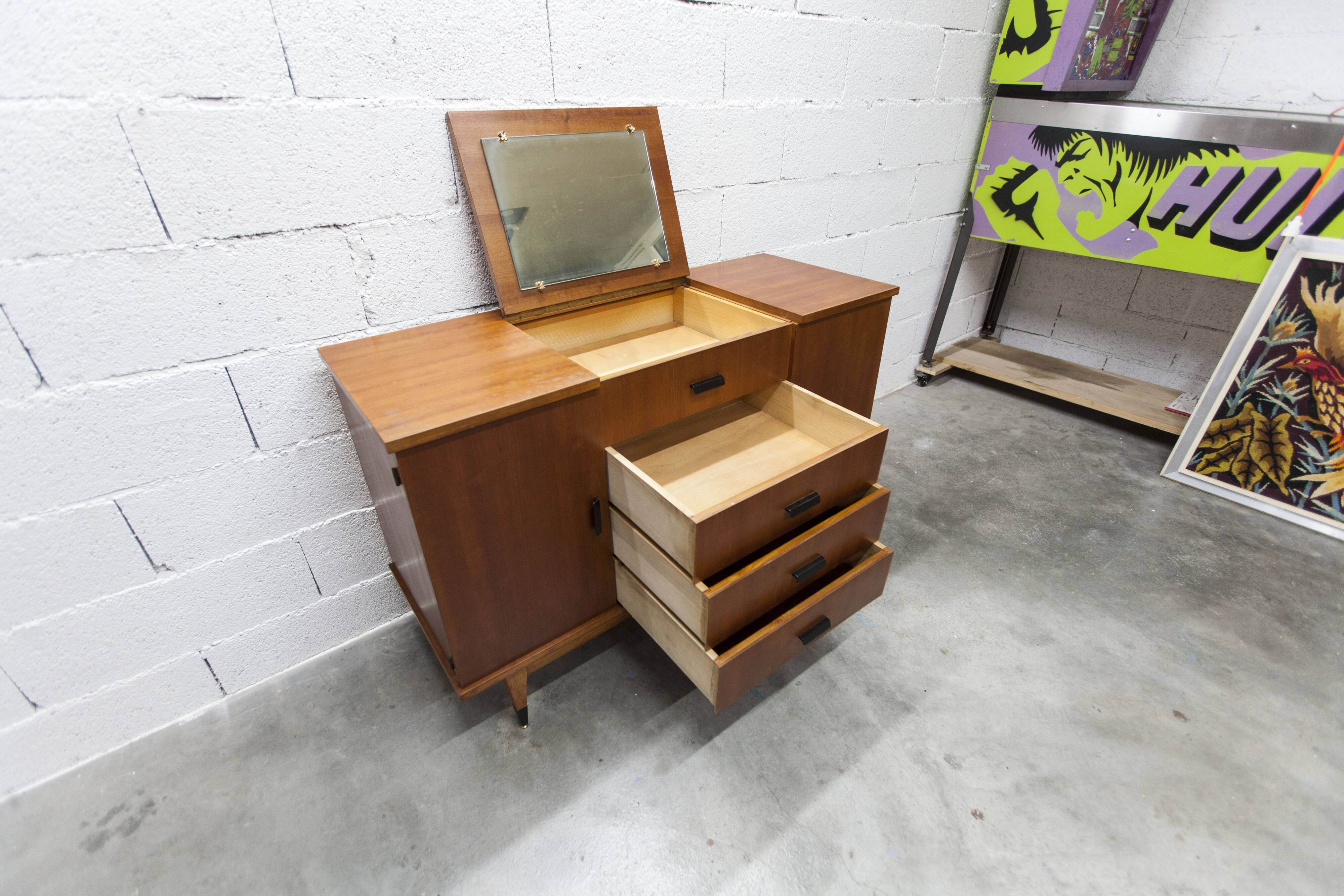 1960s teak sideboard with 4 drawers, 2 doors, and a mirror.