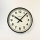 Black swiss industrial wall clock from inducta, 1960s