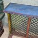 Colorful old standing eat with cast iron grill