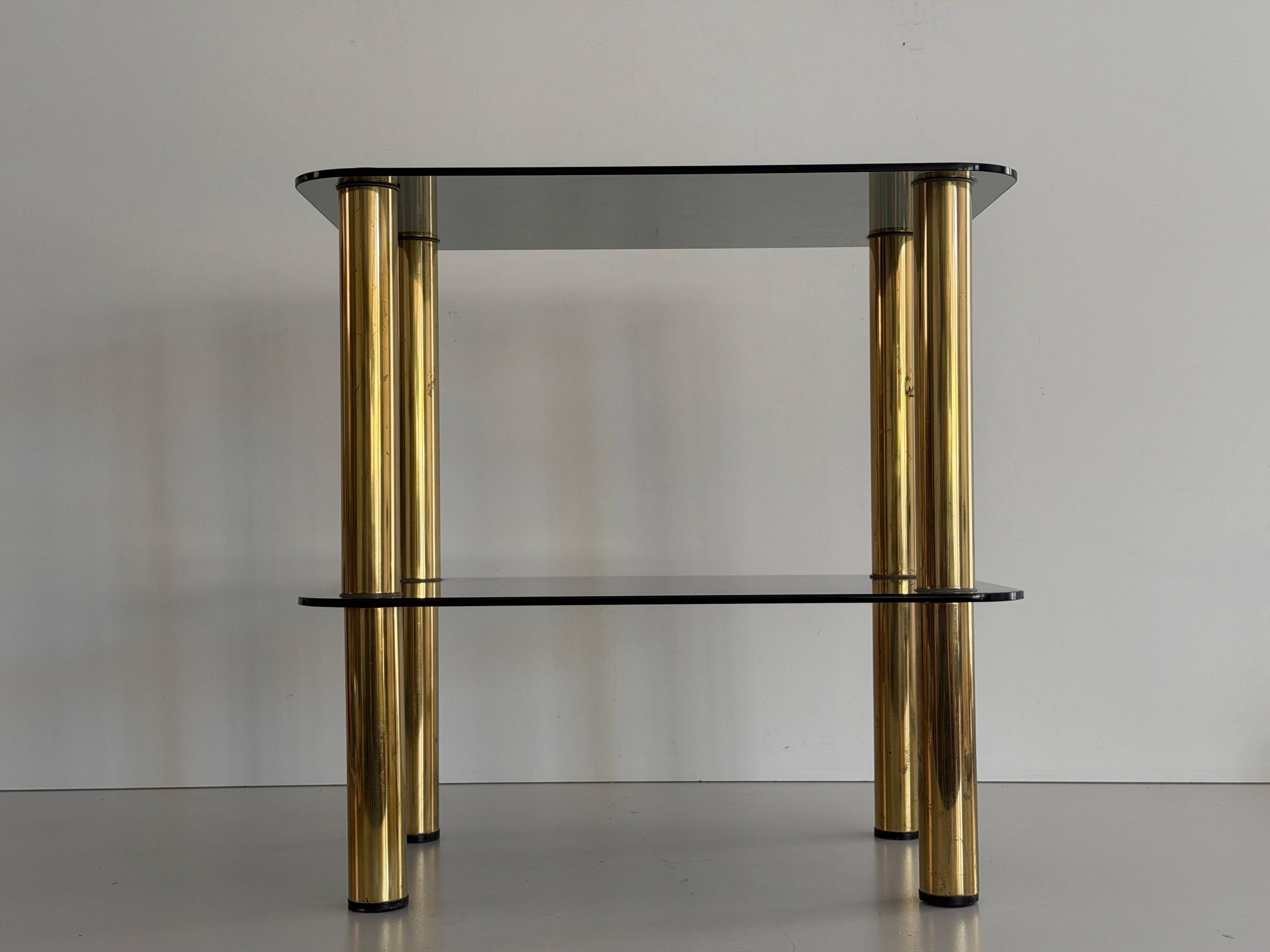Side table in thick greenish glass with brass legs, Italy, 1960s.