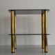 Side table in thick greenish glass with brass legs, Italy, 1960s.