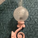 Original wall lights in pink enamelled cast iron with frosted glass globes.
