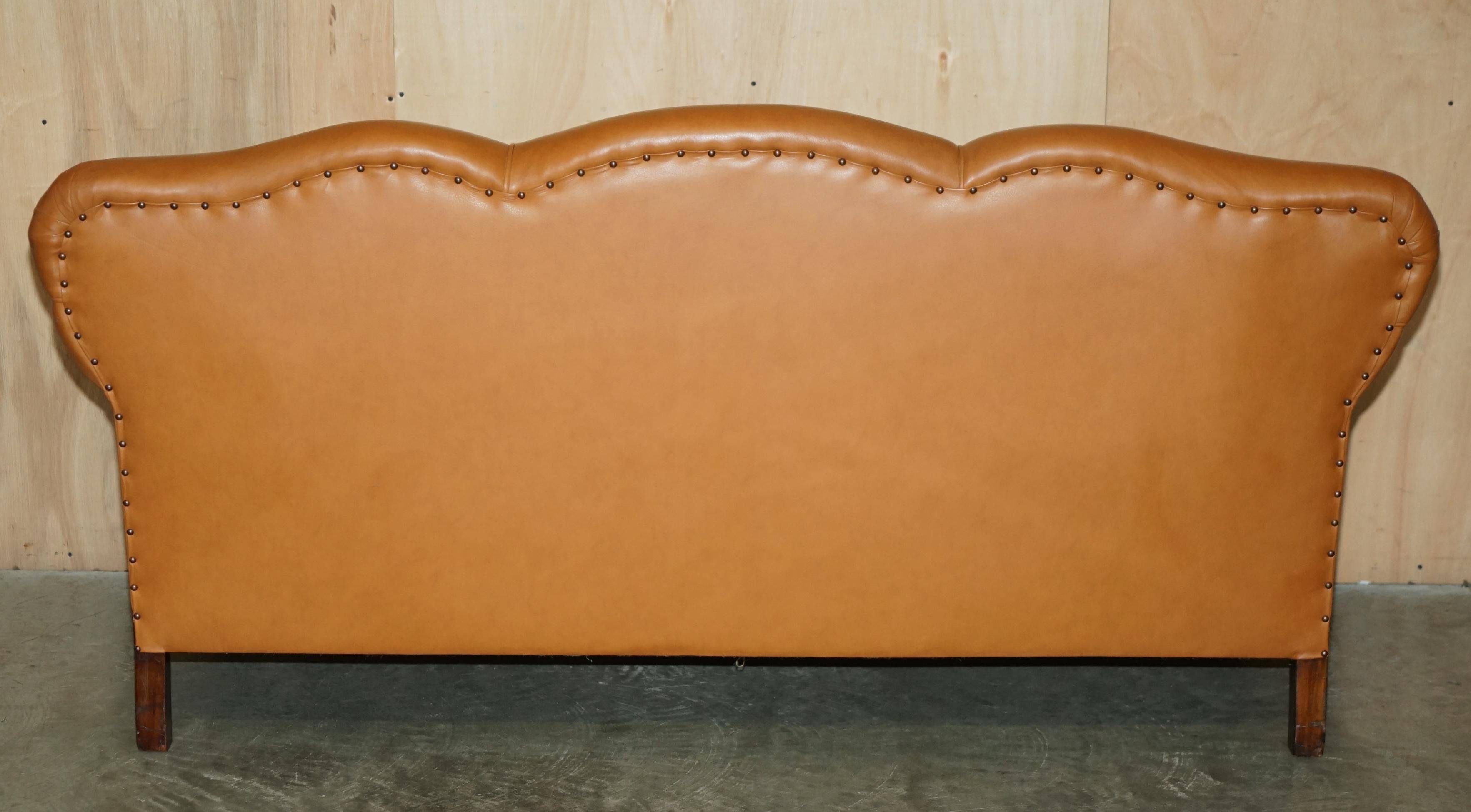 Restored three-seater leather canapé in late Victorian style.