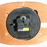 Vintage wall clock in orange formica