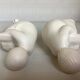 Pair of bookends with a matte white glaze for children.