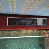 Vintage bed from the 70s with radio and built-in bedside lamp
