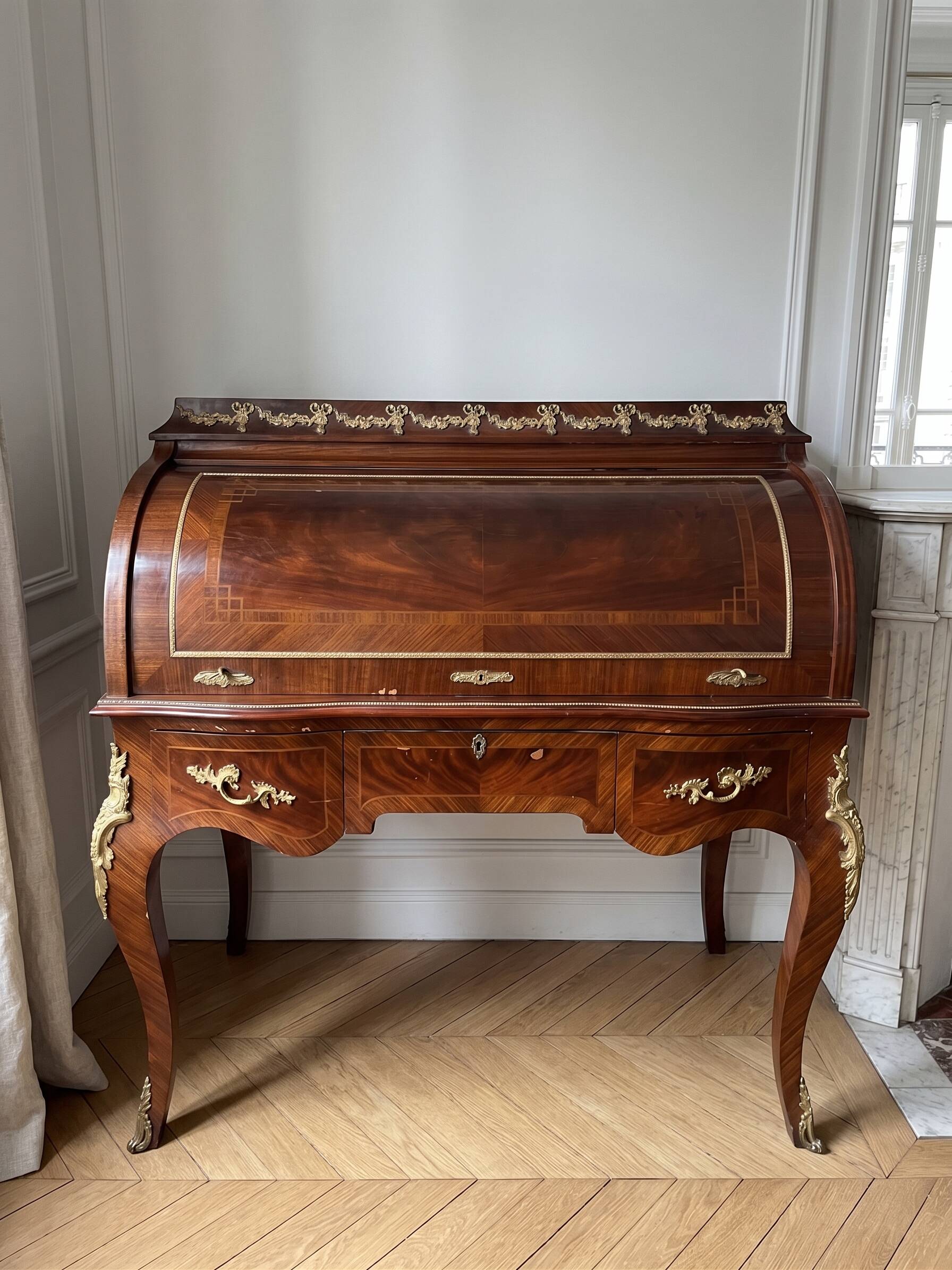 Louis XV cylinder desk with marquetry and bronze.