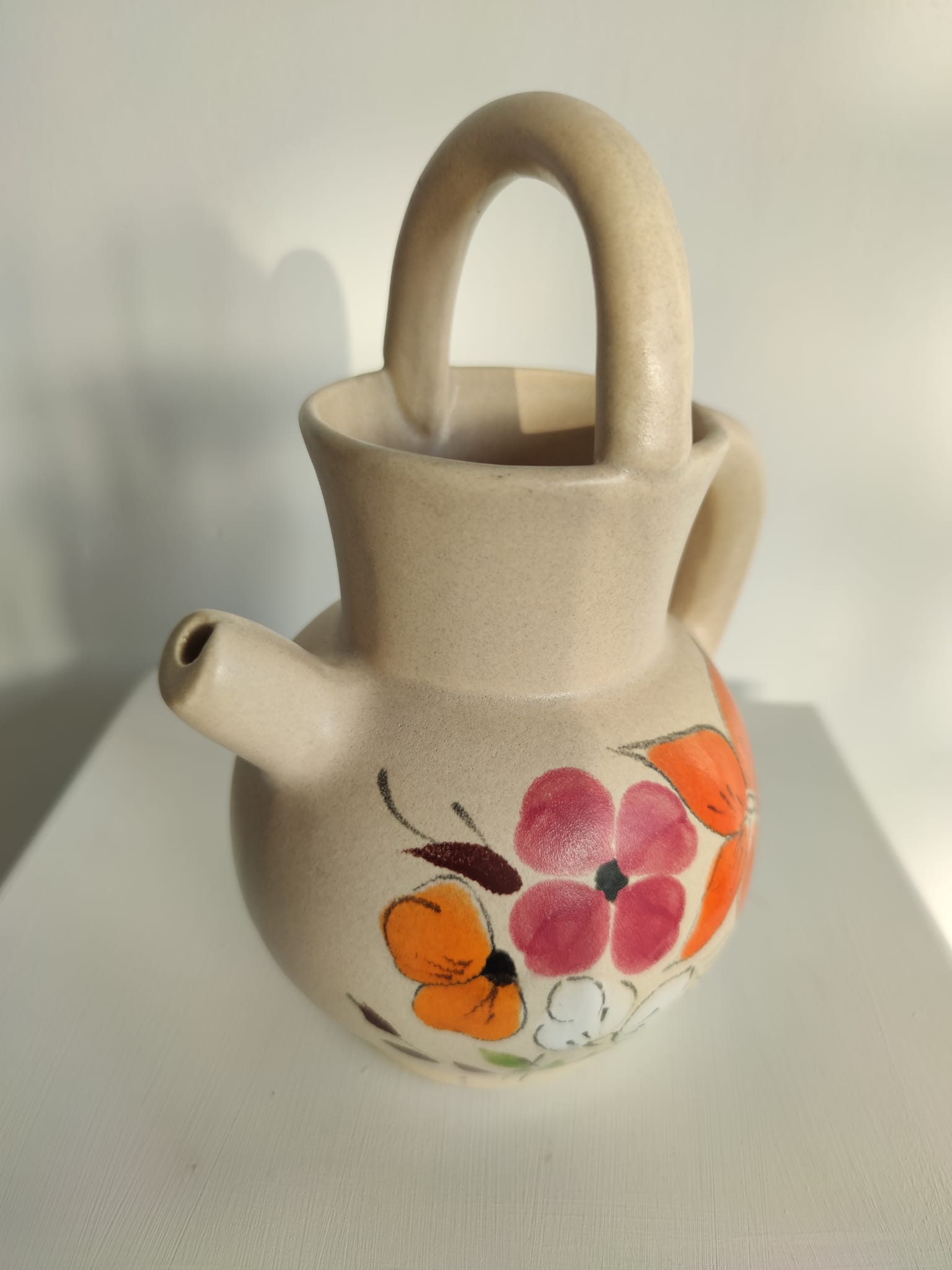 Pitcher ball in sandstone with floral pattern