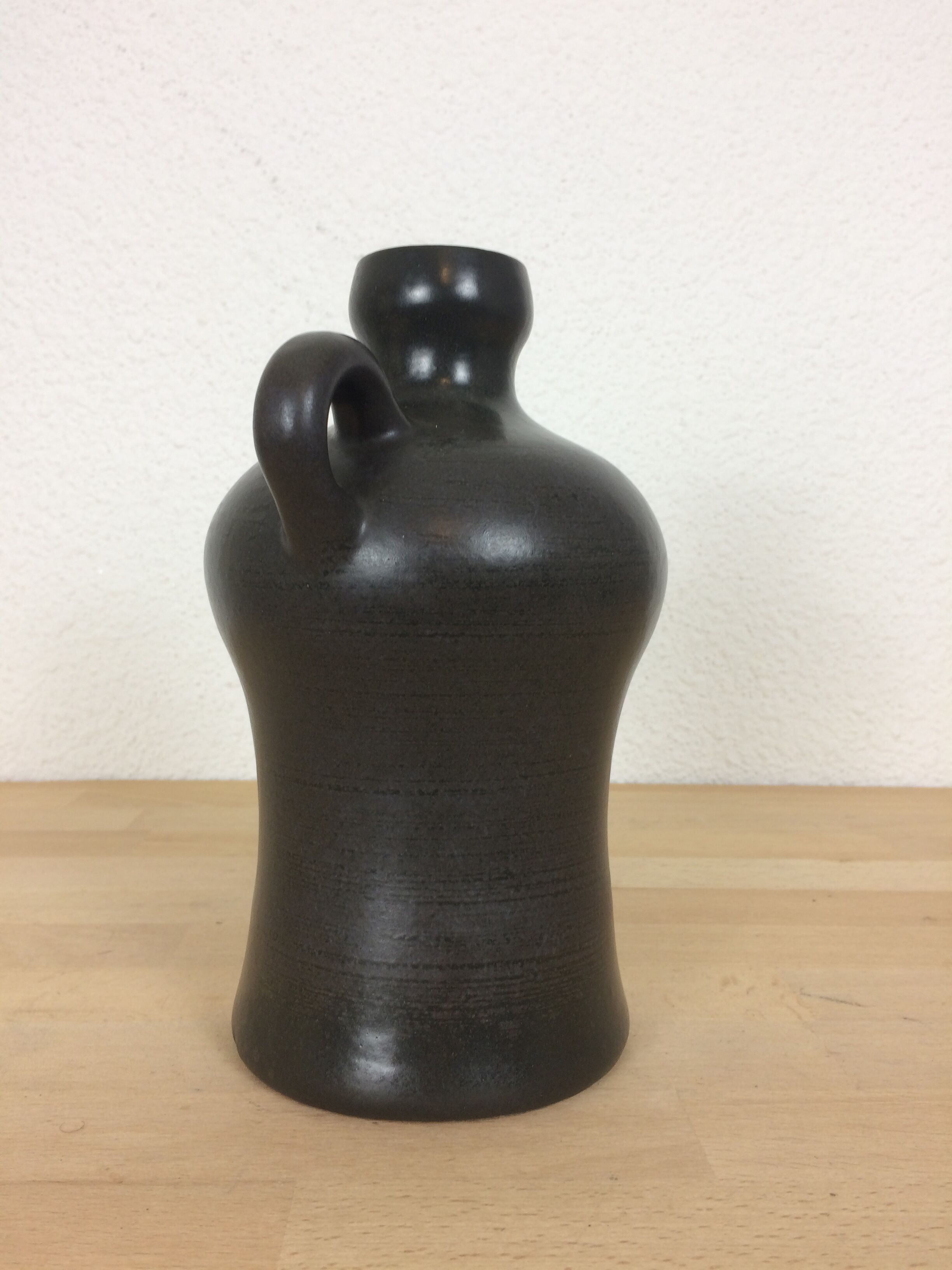 Black ceramic vase with handle