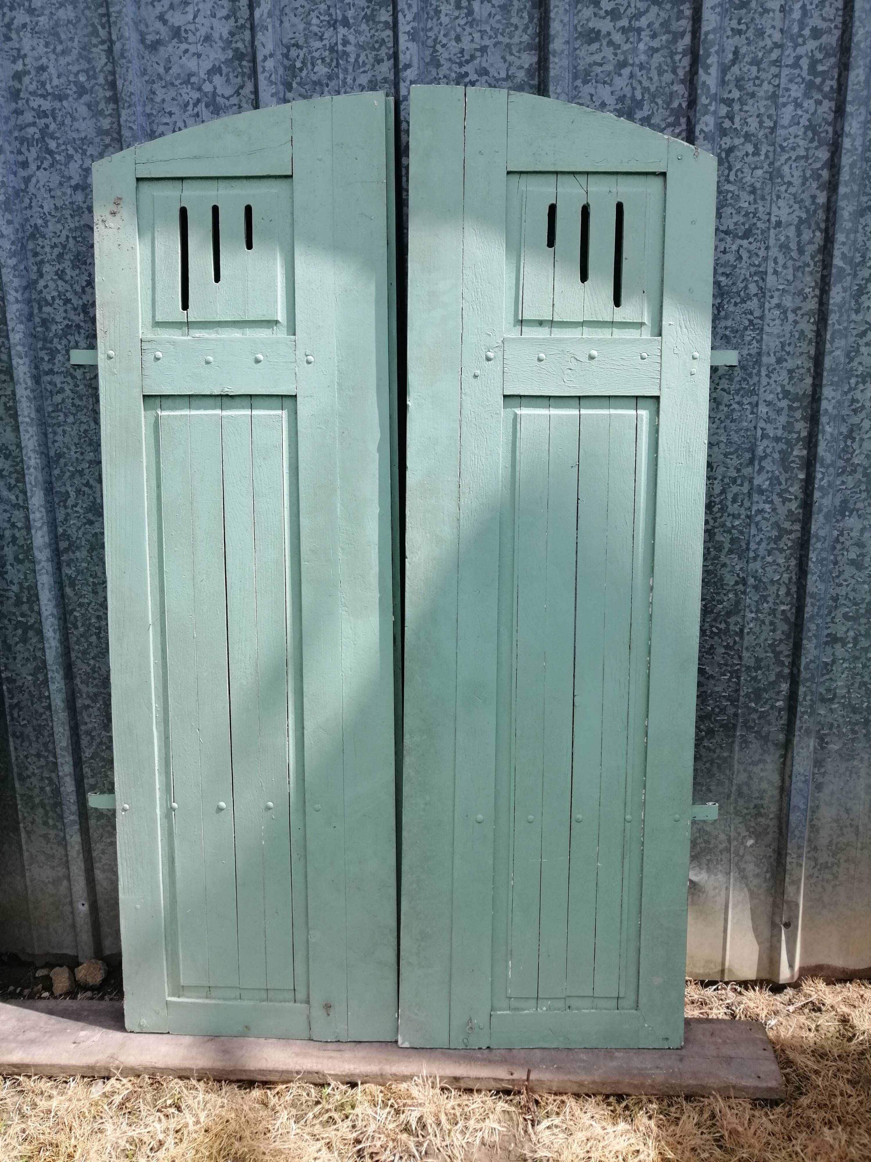 Pairs of old painted oak shutters