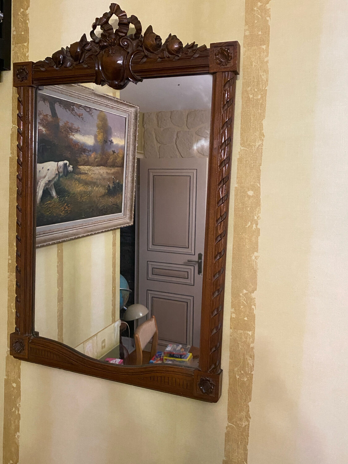 Carved wooden mirror in Louis XVI style