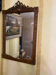 Carved wooden mirror in Louis XVI style