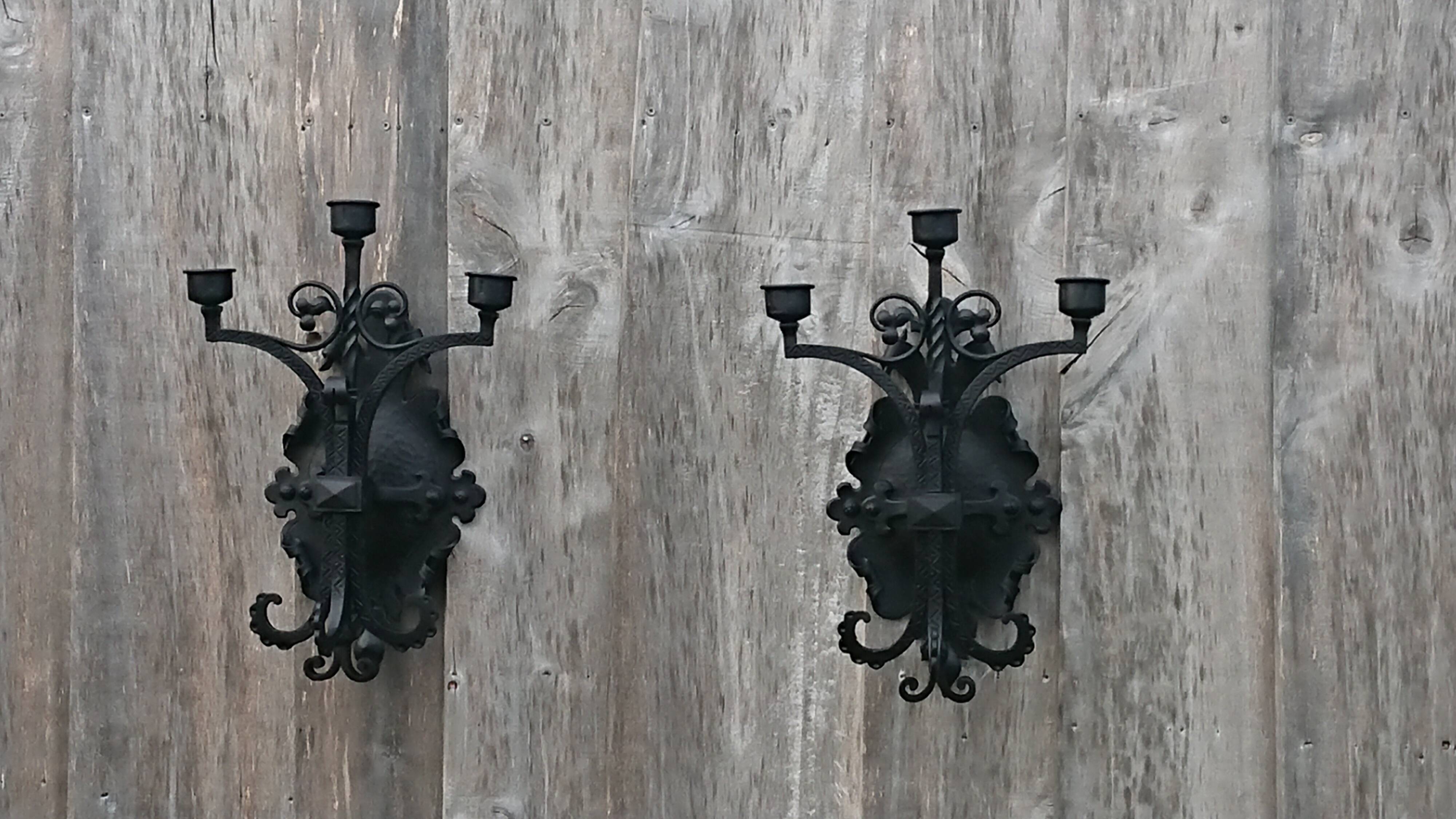 Pair of black wrought iron sconces - neo-Gothic style - from the 1950s