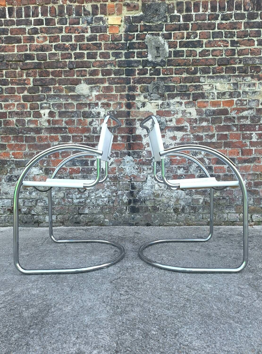 Pair of vintage tubular armchairs, designer seating furniture