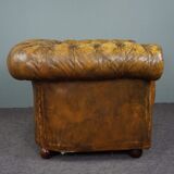Patinated Chesterfield armchair