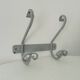 Vintage wrought iron wall coat rack