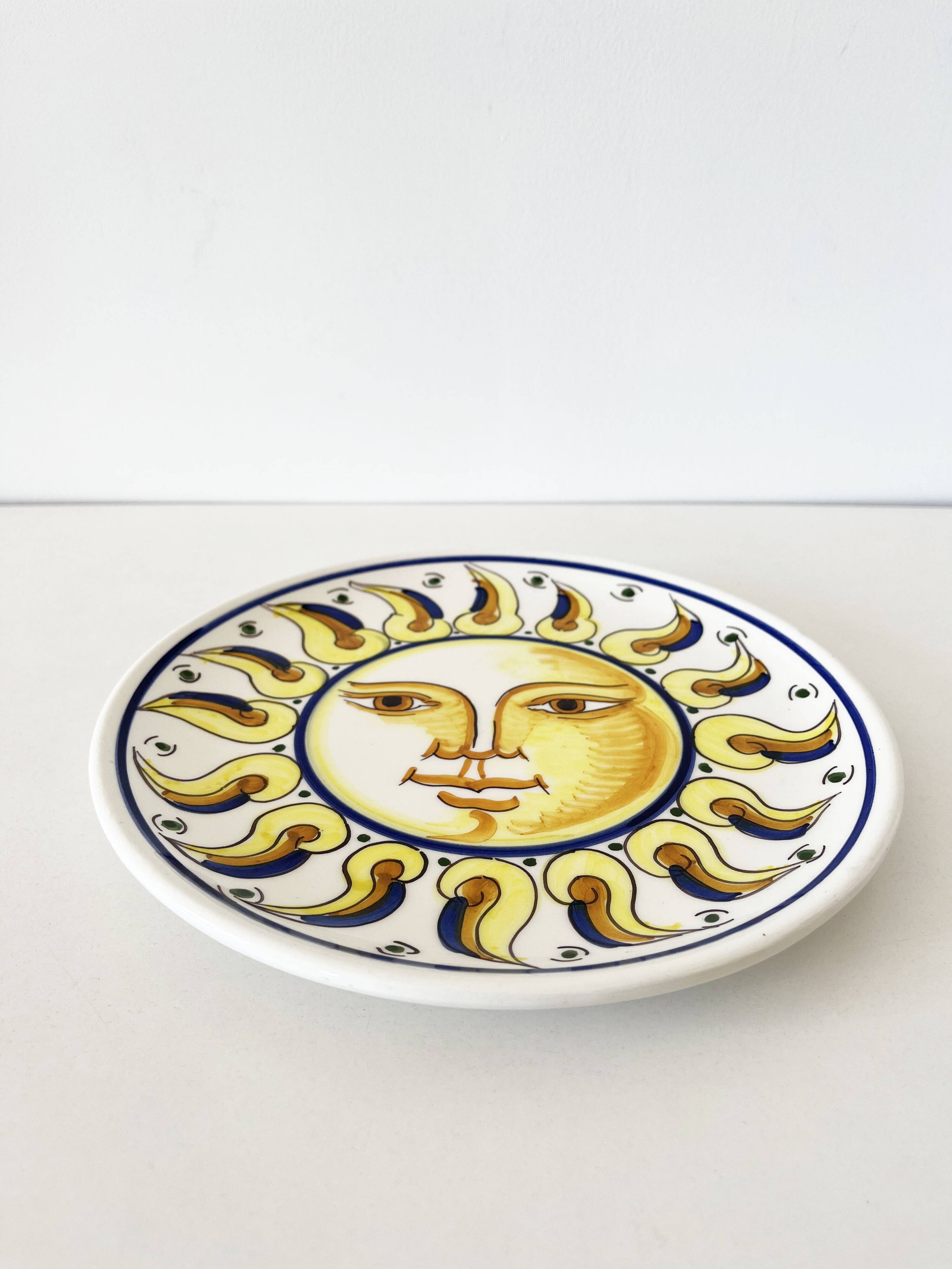 Decorative ceramic plate with sun face