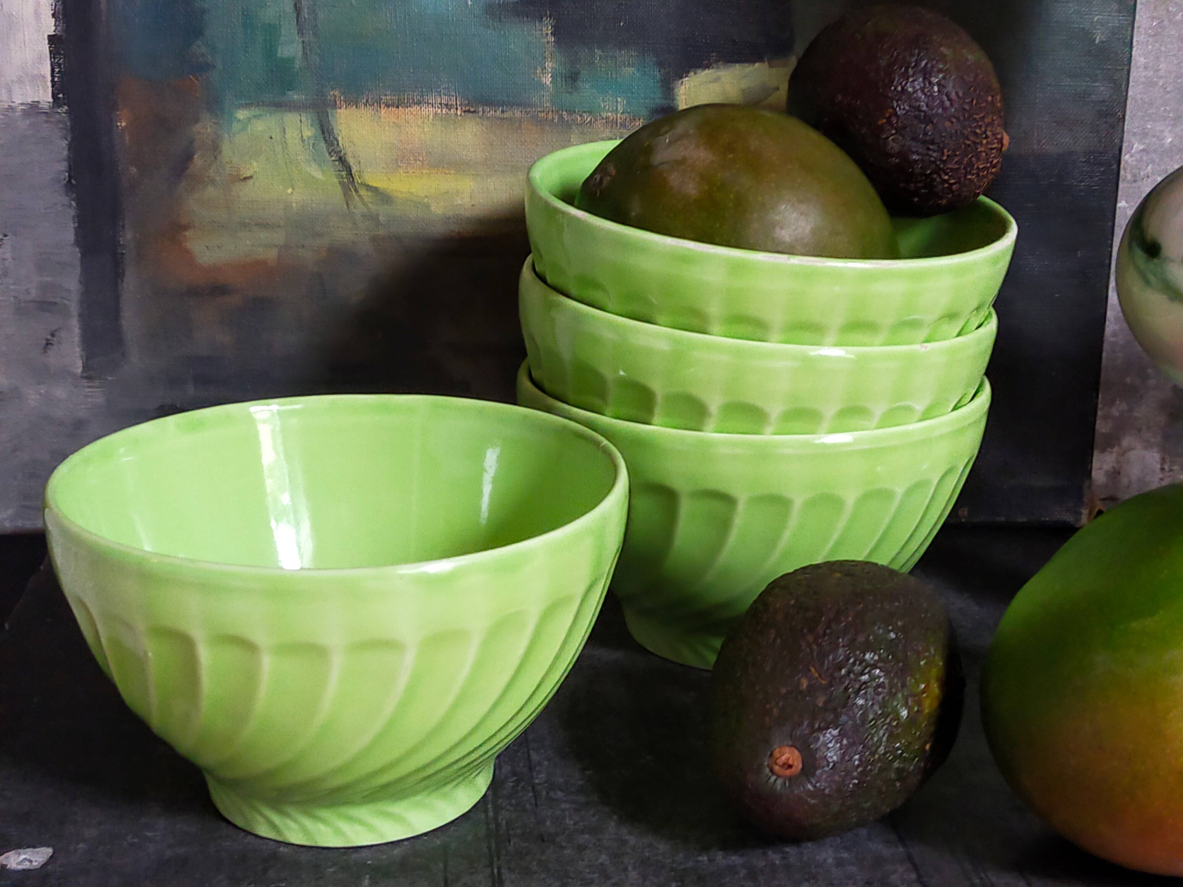 Four vintage spring green earthenware bowls