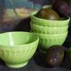 Four vintage spring green earthenware bowls