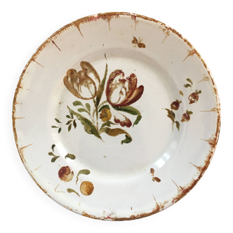 Old plate with floral decoration