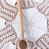 Old large vintage stoneware olive pot with its wooden spoon