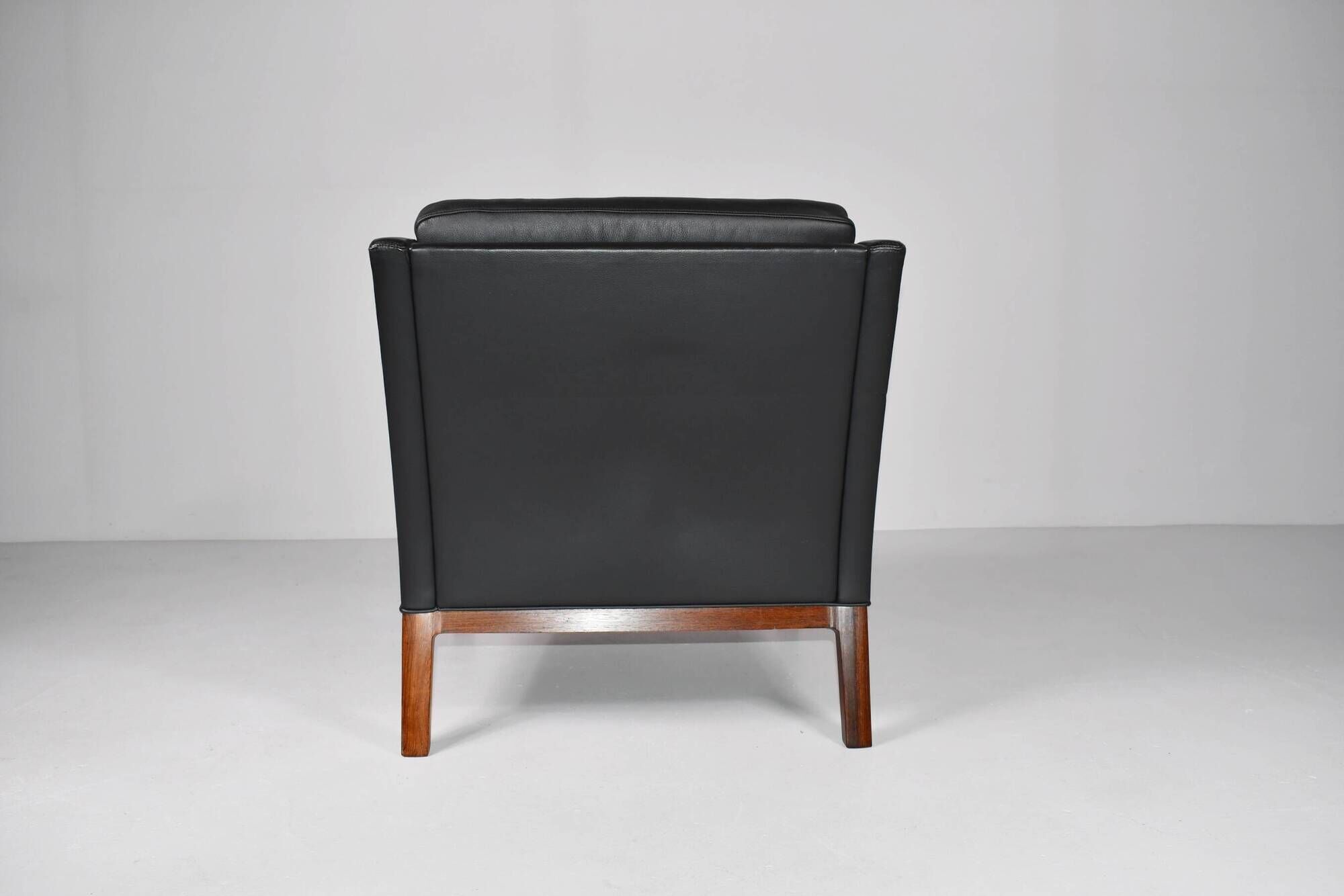 Leather and rosewood armchair by Kai lyngfeldt-Larsen. Denmark