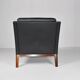 Leather and rosewood armchair by Kai lyngfeldt-Larsen. Denmark