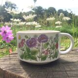 Vintage sandstone cups with flowers