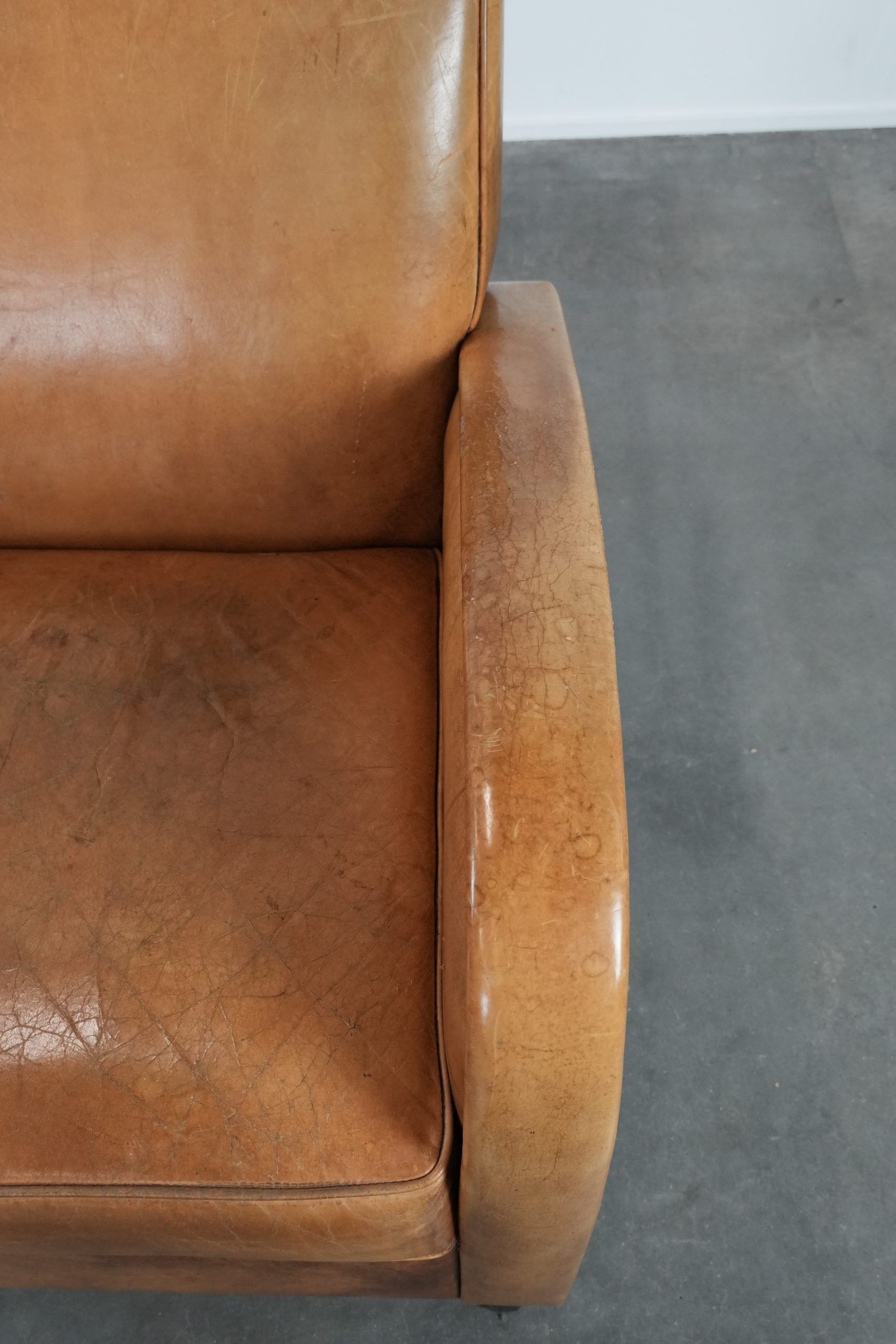Luxury armchair made of cowhide leather with a beautiful warm colour scheme
