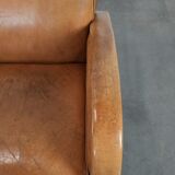 Luxury armchair made of cowhide leather with a beautiful warm colour scheme