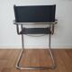 Pair of armchairs in chrome and black leather