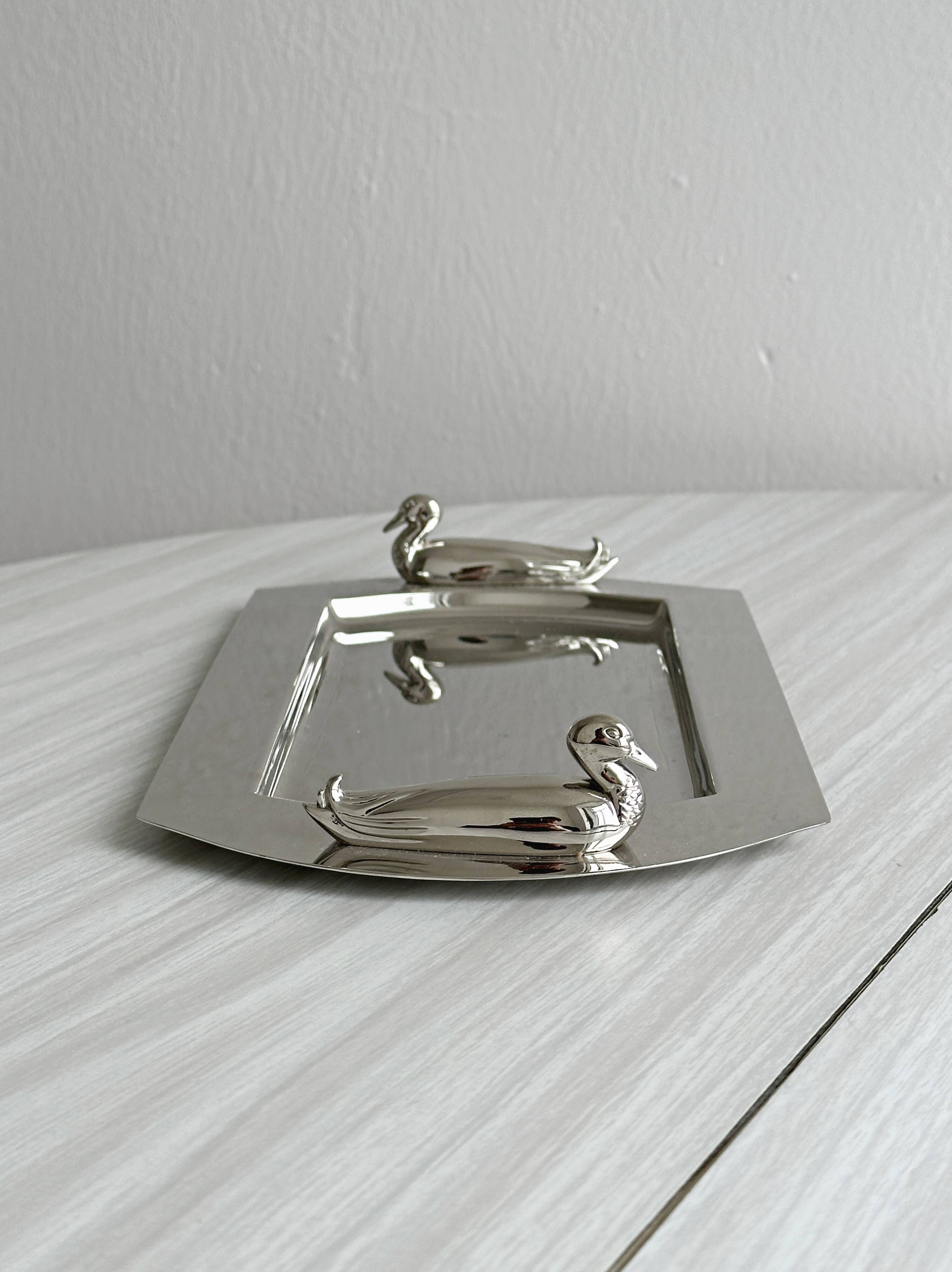 Shiny metal foie gras dish