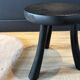 Small black wooden tripod stool