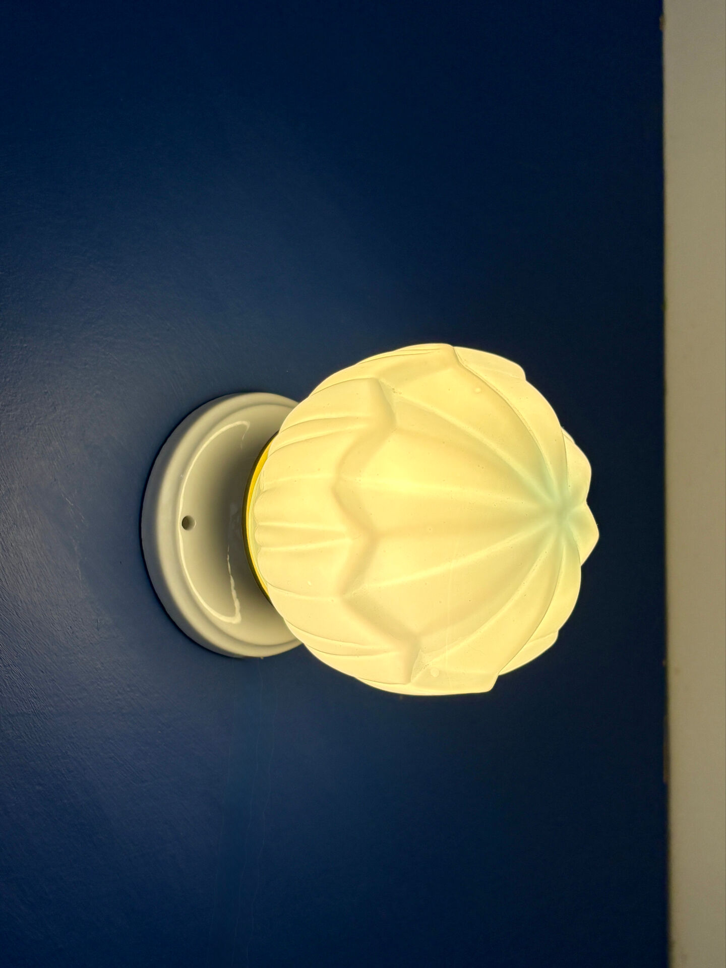 Vintage Art Deco globe wall light in blue opaline.
