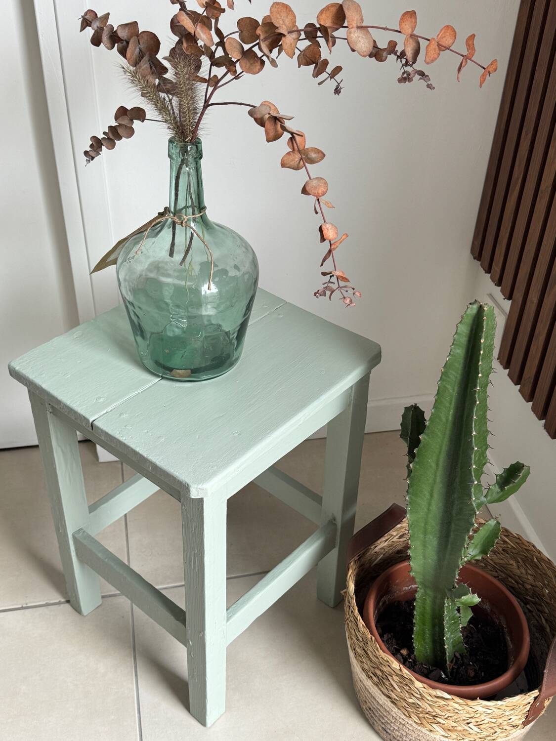 Antique almond green wooden stool