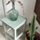 Antique almond green wooden stool