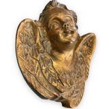 Pair of angel head wall sconces in gilded composition