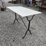 Bistro table with marble top and cast iron base